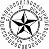 A 3-d black and white star with. The words "City of Denton Denton, Texas" encircle the star.