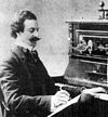 Oscar Straus at the piano.jpg