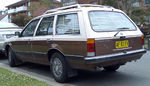 Brown and beige station wagon automobile