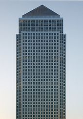 Picture of the Canary Wharf Tower set against a clear blue sky.