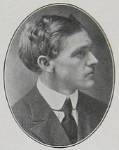 Head and shoulders of a man of about age 35 in profile in an oval frame. He is wearing a dark suit and tie and a white collar. His hair is dark, full, and wavy.