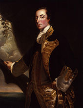 A three quarter length portrait of Admiral Rodney in relative youth.  He stands before a mostly dark background; his right hand rests on what looks like a large tree branch, behind which the sea is visible.  He wears a dark coat with gold embroidery over a white waistcoat.