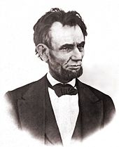 An older tired looking Lincoln with a beard.