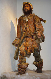 Life-size standing and fully outfitted statue of Ötzi