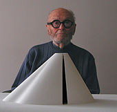 The inaugural laureate Philip Johnson behind an architectural model