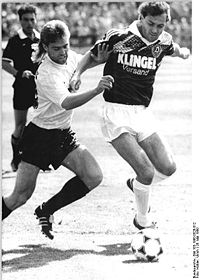 Döschner (right), being challenged by Stefan Marx of Lokomotive Leipzig in a match of 1990