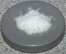 Some white powder on a round gray platform.