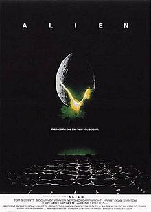 A large egg-shaped object that is cracked and emits a yellowish light hovers in mid-air against a black background and above a waffle-like floor. The title "ALIEN" appears in block letters above the egg, and just below it in smaller type appears the tagline "in space no one can hear you scream".