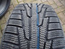 Nokia Hakkapeliitta tread shown with deep treads and many sipes (thin channels) for better winter traction