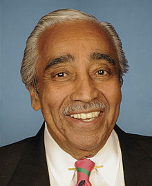 Official photograph of Charles Rangel dressed in suit and tie against a blue background