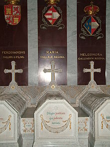 three gray stone tombs inside a church