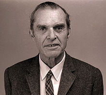 Head and shoulders of elderly man in suit and tie