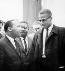 Martin Luther King, Jr. (left) speaking with Malcolm X