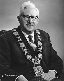 Portrait of Mayor Phillips, seated, wearing the mayor's chain of office