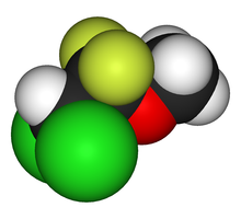 A apace-filling model, or three-dimensional structure of the methoxyflurane molecule, in red, yellow, green, black and white.