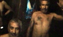 slightly grainy color video capture image showing the dirty and sweaty, slightly malnourished condition of the miners