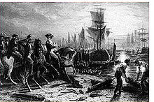 A black and white engraving, with horsemen on the left and workmen on the right. Behind them are the waters of a harbor with sailing ships at anchor.