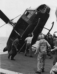South Vietnamese helicopter is pushed over the side of the USS Okinawa during Operation Frequent Wind, April 1975.jpg