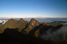 Three side-by-side mountain peaks, as viewed from the summit of Marojejy Massif.