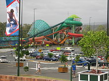 A view across Dreamworld and WhiteWater World's car park towards the Super Tubes Hydrocoaster and The Green Room.