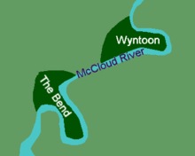 Map diagram showing two neighboring plots of land each bordered by a sharp bend in a river.