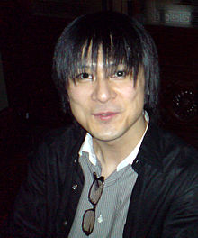 A photograph of a thin, dark-haired Japanese man