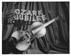 promotional photo showing a fiddle with the words Ozark Jubilee above it