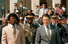 President Samuel Doe walks with U.S. Secretary of Defense Caspar Weinberger during a visit to Washington DC in 1982