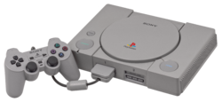 The original light grey PlayStation model with DualShock.
