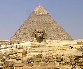 Giza Plateau - Great Sphinx with Pyramid of Khafre in background.JPG
