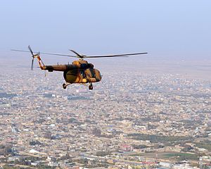 Afghan National Air Force Mi-17 flying over the city