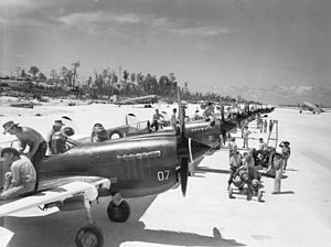 No. 80 Squadron Kittyhawks being prepared for ground attack missions in 1944