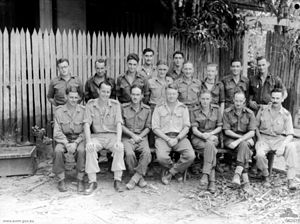 No. 61 Wing headquarters personnel at Darwin in June 1944. The commanding officer, Wing Commander D.J. Rooney, is in the centre of the front row.
