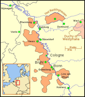 The territory is divided into nine sections; the main section borders the west bank of a wide river, and includes several important cities; other territories to the south and on the east bank of the river, are considerably smaller, and a crescent of territory south of Linz. Further north is a small section, still on the river, but separated from the main part of the territory. East of this section is "Vest Recklinghausen", and east of that is the Duchy of Westphalia. Nearby cities are, to the west, Nijmegen and Venlo, and to the east, Duisburg, Düsseldorf, and Dortmund. A big dot marks the location of Cologne, but it is distinguished from the territory by a border.