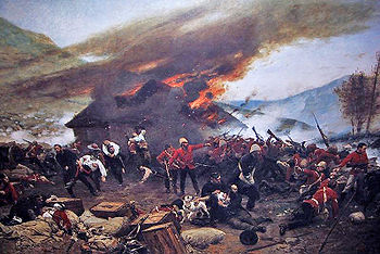 Burning hut in the background; red-jacketed soldiers fighting in the foreground